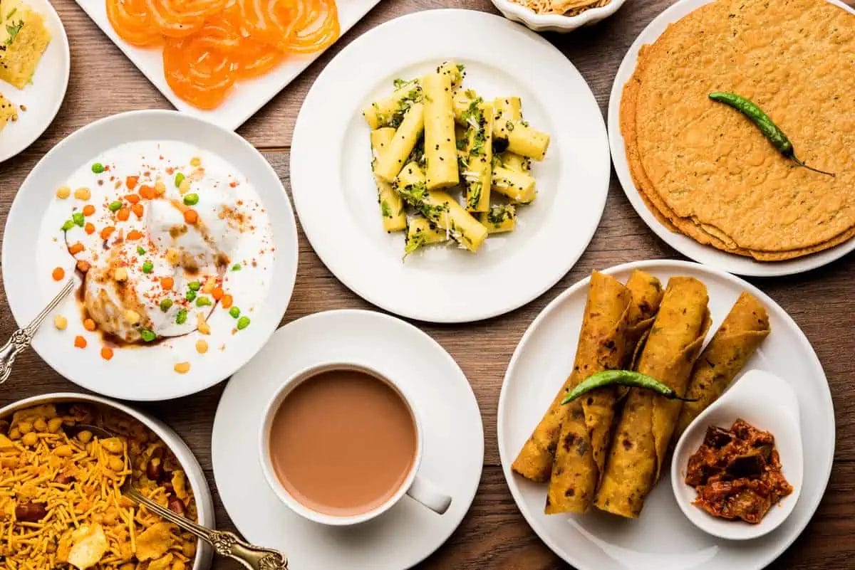 Top Indian Restaurants in Pattaya: Discover the Best Indian Food and Vegetarian Delights 1 A platter of Gujarati snacks with jalebi, dhokla, and chai, capturing the essence of Gujarati tea-time