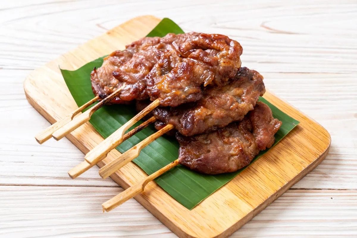 The Best Street Food in Bangkok: Markets, Dishes, & Where to Find Them 5 Moo Ping (Grilled Pork Skewers)