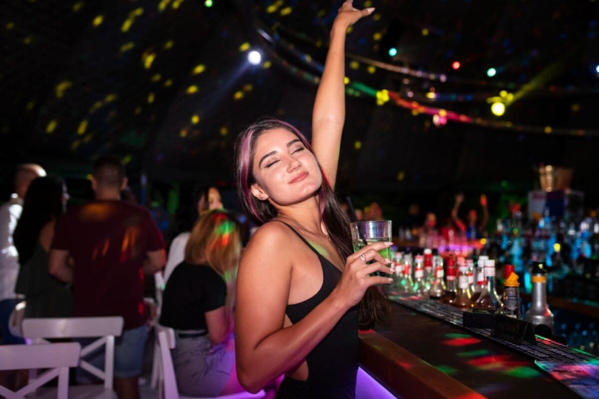 From Dancers to Drinks: A Guide to A Go Go Pattaya 1 People enjoying the nightlife at bars and clubs, having a fun time