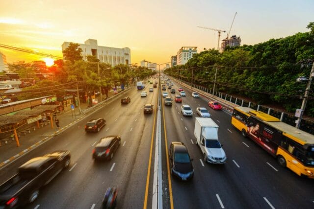 Traffic near Kasetsart University on Ngamwongwan Road, Bangkok, Thailand, showcasing the relevance of Taxi Bangkok services