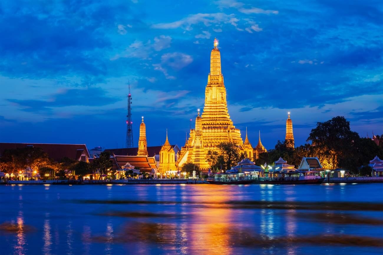 10 Best Places to Visit in Bangkok: A Comprehensive Guide 1 Wat Arun, the famous Temple of Dawn in Bangkok, Thailand, is a renowned Buddhist temple and tourist landmark, beautifully illuminated in the evening.